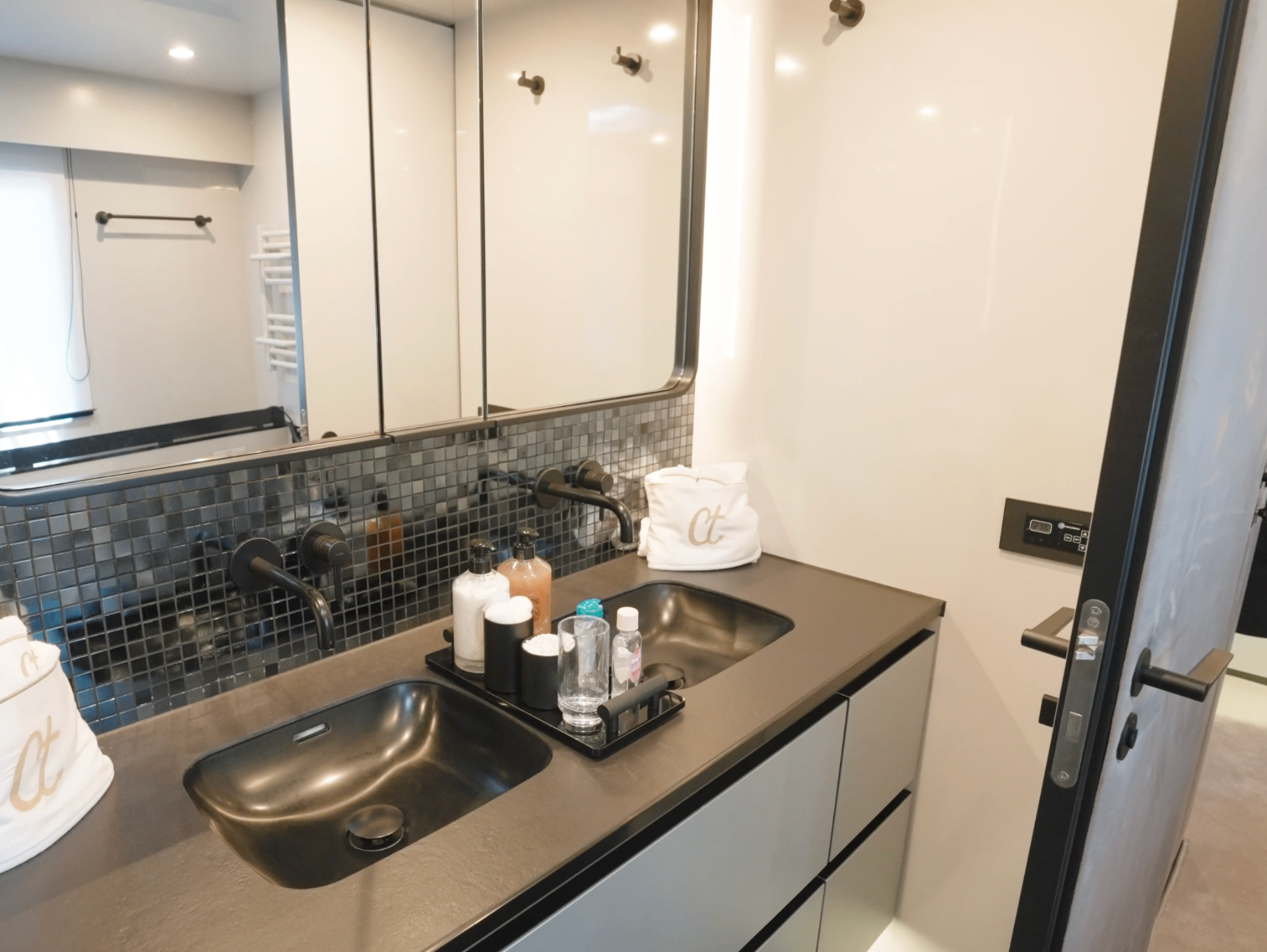 CATALLAXY en suite double vanity with mosaic backsplash